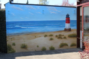 Graffiti Garagenwand Leuchtturm Strand
